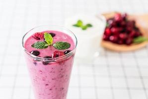 Mixed berries with yogurt smoothies on the table photo