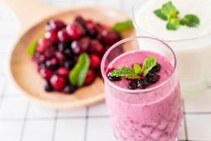 Mixed berries with yogurt smoothies on the table photo