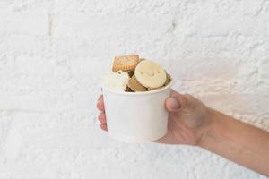 Homemade ice cream in cup with biscuit photo