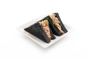 Tuna charcoal sandwich on white background photo