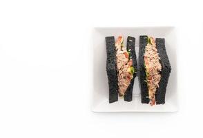 Tuna charcoal sandwich on white background photo