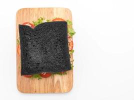 Tuna charcoal sandwich on white background photo