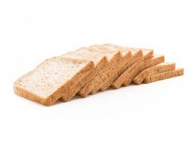 Whole wheat bread on white background photo