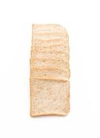 Whole wheat bread on white background photo