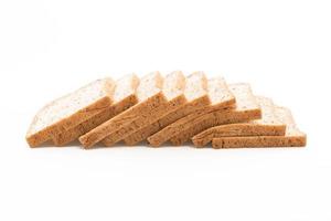 Whole wheat bread on white background photo