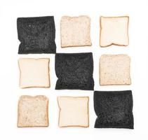 Charcoal, milk, and whole wheat bread on white background photo