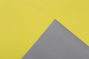 Illuminating yellow and Ultimate Gray pastel paper texture background photo