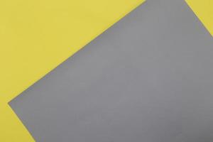 Illuminating yellow and Ultimate Gray pastel paper texture background photo