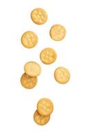 Cracker cookies falling isolated on white background photo