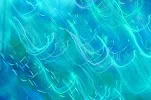 Abstract background of lights glowing blue with colorful strokes photo