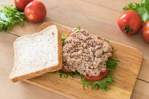 Tuna sandwich on wood board photo