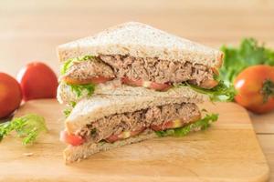 Tuna sandwich on wood board photo