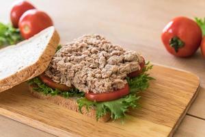 Tuna sandwich on wood board photo