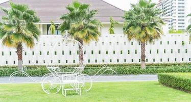 Pumpkin carriage decoration in the garden with empty space photo