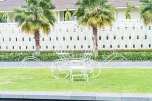 Pumpkin carriage decoration in the garden with empty space photo