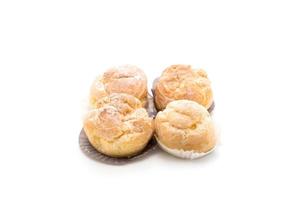 Cream puff on white background photo