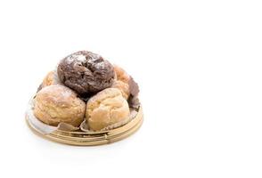 Cream puff on white background photo