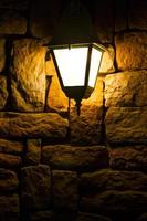 Night Lamp on a Brick Stone Wall photo