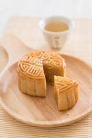 Fresh moon cake on wood plate photo