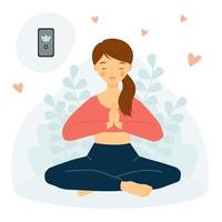 The girl practices yoga with phone. Yoga Mobile App.