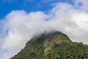 Abraao mountain Pico do Papagaio with clouds. Ilha Grande Brazil. photo