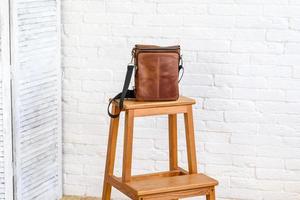 Beautiful brown bag made of leather designed for various items photo