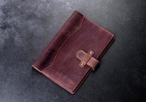 Beautiful leather brown case made of leather designed for a notebook photo