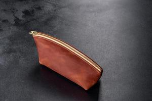 Beautiful leather brown purse made of leather to store paper money photo