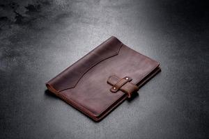 Beautiful leather brown case made of leather designed for a notebook photo