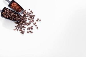 ground coffee, coffee beans, white background photo
