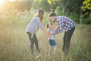 Happy young family spending time together outside. Family love concept photo