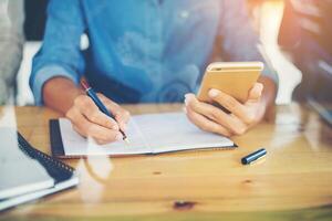 business woman hand working on smart phone with  business graph. photo