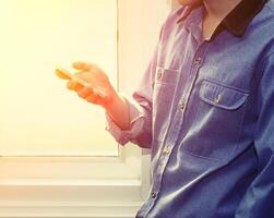 handsome man using mobile smartphone at home photo