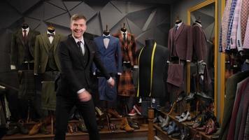 Man posing with suits photo