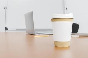 cardboard mug on an office table photo