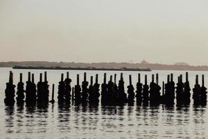 Old car tires, made into a wave barrier, Warm tone photo