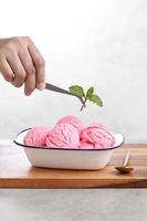 Food stylist use tweezers decorating fake icecream