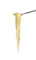 Cooked spaghetti in fork on white background photo