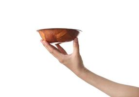 Chef holding wooden cup on white background photo