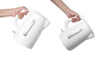 hand pouring water from modern kettle water boiler on white background photo