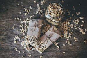 Homemade Granola with Nut Mix In Jar on wooden background photo