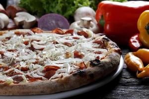 Pizza and vegetables photo