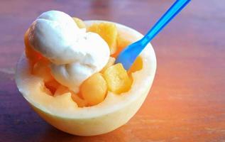 Ice cream fresh coconut on the wooden floor photo