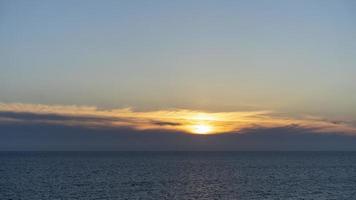 Seascape with a beautiful sunset on the background of the sea photo