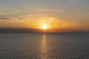 Seascape with a beautiful sunset on the background of the sea photo