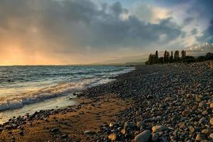 Seascape with a beautiful sunset on the background of the sea photo