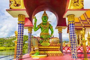 Green god statues and architecture at Wat Plai Laem temple, on Koh Samui island, Thailand
