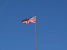 UK Flag over blue sky photo