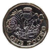 Nueva moneda de 1 libra, Reino Unido aislado sobre blanco foto