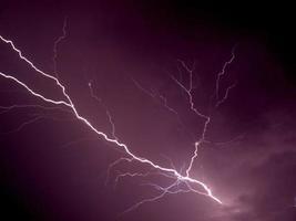 Lightning bolt at night photo